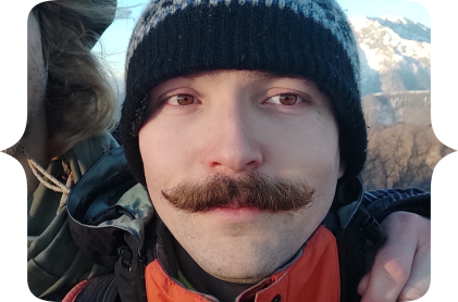 Myself during a hike in the Alps. I'm wearing a cap. Here we just reached the summit. There's another secret behind this p-i-c-t-u-r-e. Maybe one day I'll tell you.